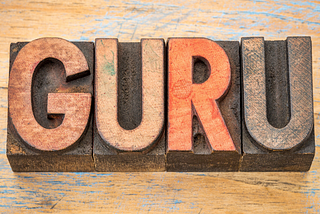 wooden letters forming the word guru