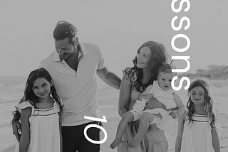 10 Lessons in 10 Years of Motherhood Family of 5 Walking on Beach Black and White Photo