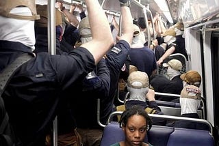 Woman looking anxious as she’s surrounded by Patriotic Front lunatics
