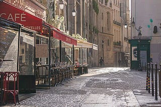 An image of a Parisian street and cafe