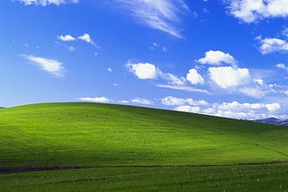 Windows XP “Bliss” wallpaper with green hill and blue sky