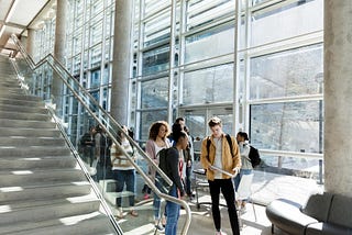 College building lounge with group of students. Photo by SDI Productions/Getty Images