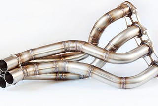 What is the exhaust manifold and what is it responsible for?
