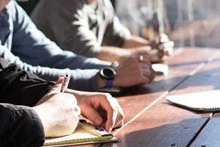 People working at a desk.