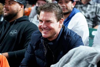 At the Dodgers-Giants game, Tom Cruise smashes a home run with the fans.