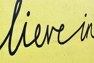 Believe in Yourself Writing on Gambole Yellow Wall 