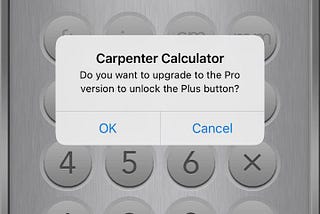 Image of a calculator with a popup that says “Do you want to upgrade to the Pro version to unlock the Plus button?”