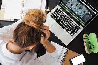 employee frustrated with laptop