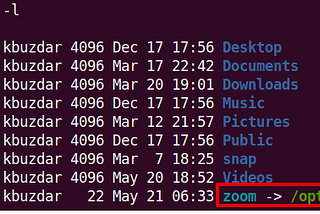 Courtesy of Linux Hint. Screen capture of a LINUX terminal window with the symbolic link “zoom” pointing to the Zoom Launcher program. The “zoom” link is in light blue and the target Zoom Launcher is in green.