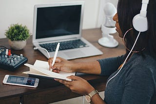 Woman writing in notebook