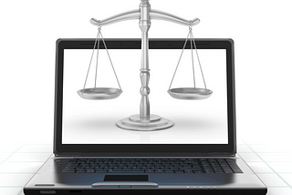 Laptop with justice scales on the screen