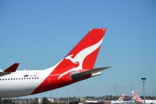 Aeroplane with the Qantas “Flying Kangaroo” logo on the tail.