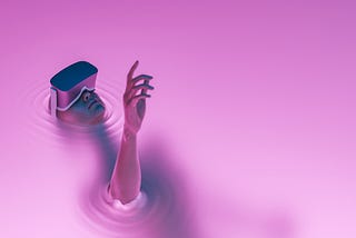 A person with a VR headset on is drowning in pink liquid