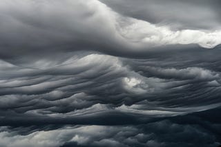 dark clouds moving in waves