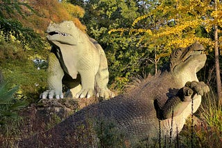 Statues of iguanadons in the Crystal Palace dinosaur park