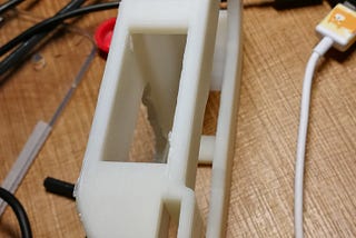 A stabilizing bracket to prevent wobble on the device