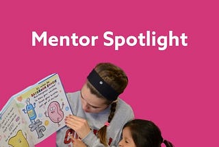 Mentor Amanda reading a children’s book to one of her mentees.