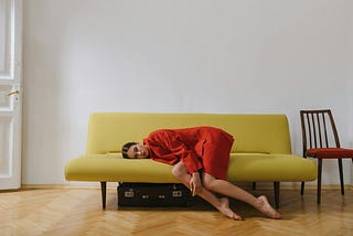 woman lying on a sofa