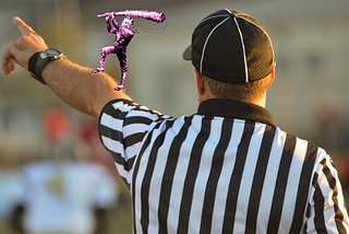 A referee in a striped jersey extends his arm to make a call; perched upon his arm is a vintage newspaper political cartoon of Roosevelt as a trustbuster, swinging a club.