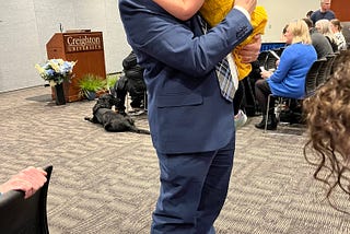 Me holding Nora at the ceremony.