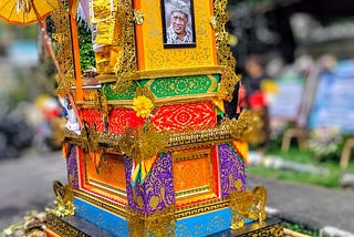Brightly covered cremation tower in which decedent was transported to cremation ceremony.