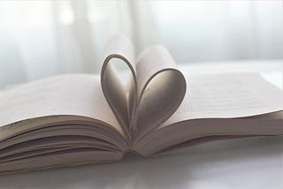 Pages in an open book shaped like a heart
