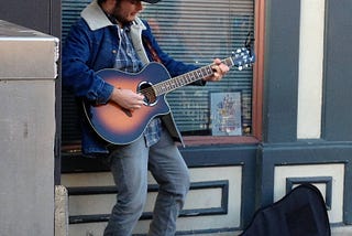 Playing on the street in Nashville in 2014 to make enough to buy myself dinner.