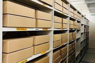 Rows of brown archive boxes that represent completed clinical study archive cataloguing.