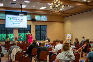 MI Treasury Outreach Manager Sarah Rusnell speaks to a room of workshop attendees