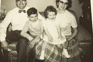 Mom and Dad with my brother Jay and I. Jay, who was eight years older, was also adopted. He died at age 29, and never had any desire to find his birth family.