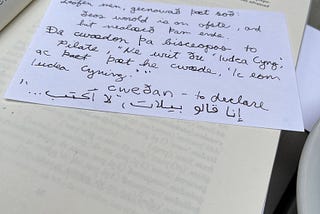 A notecard showing Old English and Arabic