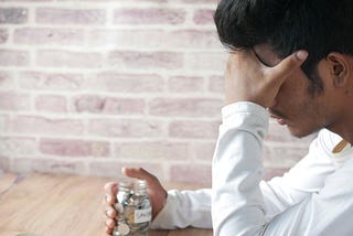 man fretting over his savings. negativity can be empowering