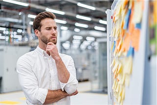 businessman thinking about switching desk booking solution