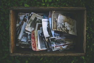 A box of old photos. Photo by Kaboompics .com from Pexels.