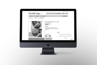 Image of product page designer on black iMac with white background and grey shadow