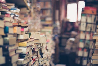 Stacks of books in a used bookstore.