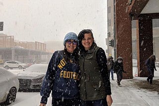 My friend Mary and I taking a break from school in the snow