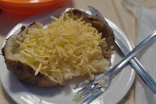 A huge baked potato with vegan ‘cheese’ that shows no sign of melting.