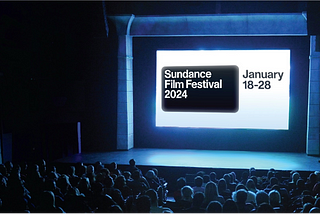 A promotional image for the 2024 Sundance Film Festival featuring the festival name and dates projected on a movie screen in a crowded theater.