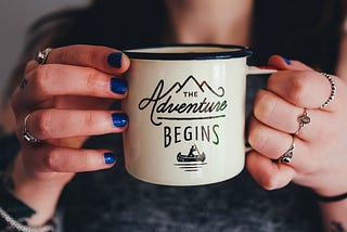 A woman holding a mug.