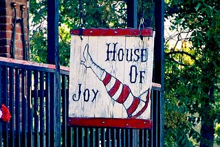 Store sign for House of Joy, a gift shop in Jerome AZ