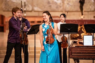 Chamber musicians on string instruments performing