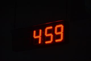 a digital clock reading 4:59