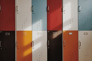 Colorful lockers with sunlight shinning upon them.