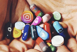 Pills with social media platform logos on them