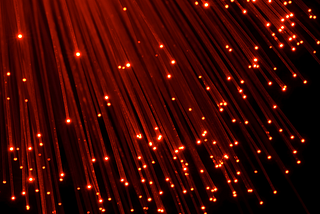 Red light fiber optic strands — Featured image for 9 Immediately Actionable Website Tips For Higher Traffic and Earnings by Amanda Stacks