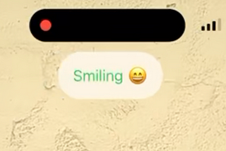 Smiling text on screen after a user has smiled.