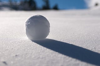 A Snowball Rolling Down a Hill