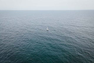 image of a boat in the middle of the ocean.