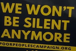Sign reading “We won’t be silent anymore.”